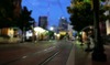 Tram picking up lonely people on hot summer evening in downtown area of Dallas, TX, USA. (Photo illustration)
