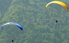 Paragliders are taking off on slopes of Vogar above Bohinj, Slovenia. Planina Vogar (Meadows of Vogar) is among most popular paragliders places and is laying about 500 meters above Bohinj and Bohinj lake.
