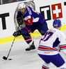 Tomaz Razingar (no.9) of Slovenia (L) and Russell Cowley (no.17) of Great Britain (R) during ice hockey match of IIHF Ice hockey World championships Division I, group B between Great Britain and Slovenia. Match between Great Britain and Slovenia of IIHF Ice hockey World championships Division I, group B was held on Tuesday, 20th of April 2010 in Ljubljana, Slovenia.
