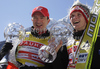 Winner Thomas Morgenstern of Austria (M) with his coach Alexander Pointner (L) celebrates World cup overall medal won in FIS ski jumping World Cup 2010-2011. Final race of  FIS ski jumping World cup 2010-2011 was held on Sunday, 20th of March 2011, in Planica, Slovenia.
